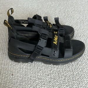 Dr. Martens sandals in black.